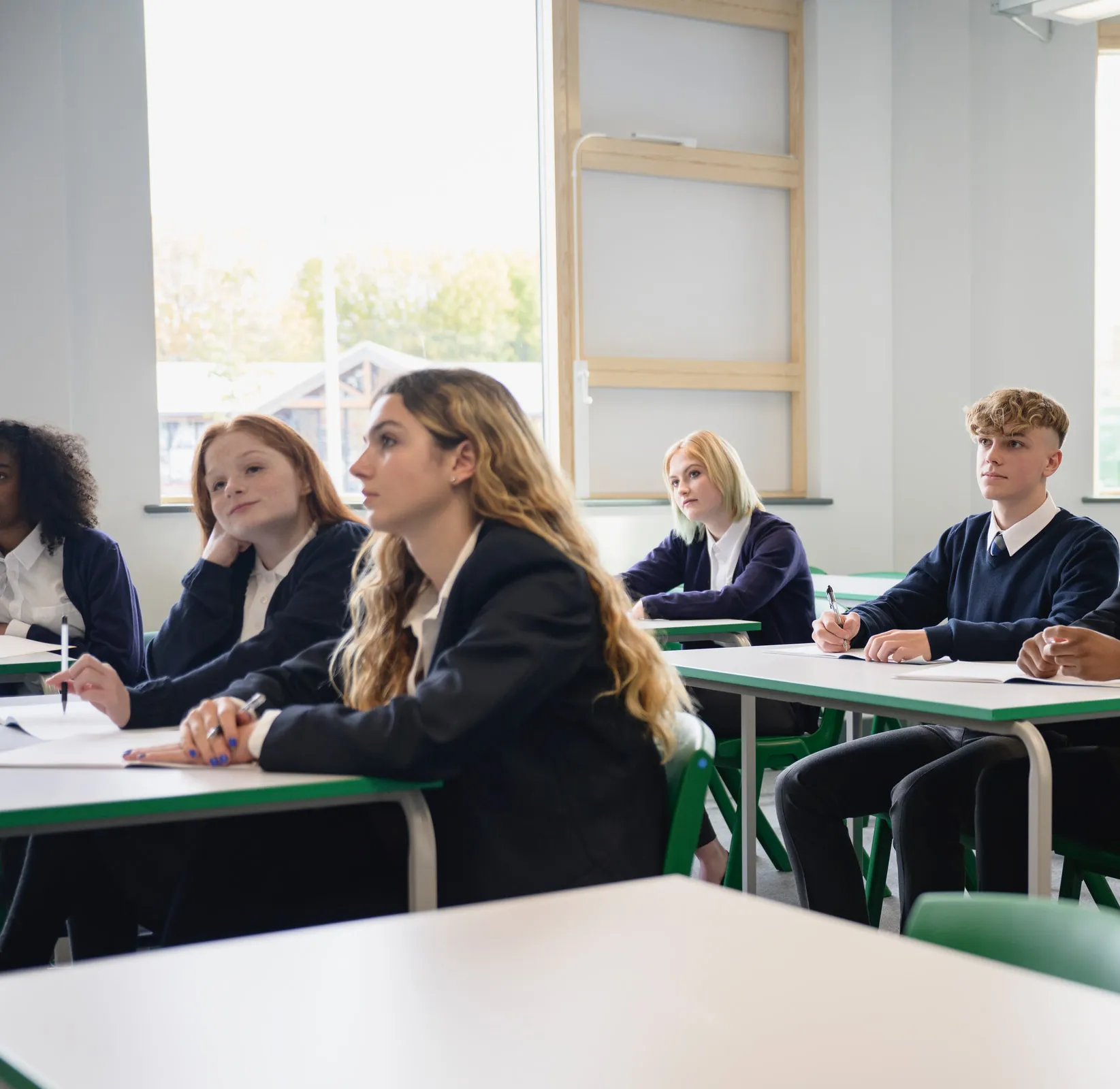 A senior Vaughan College class in session, students in uniform at their desks