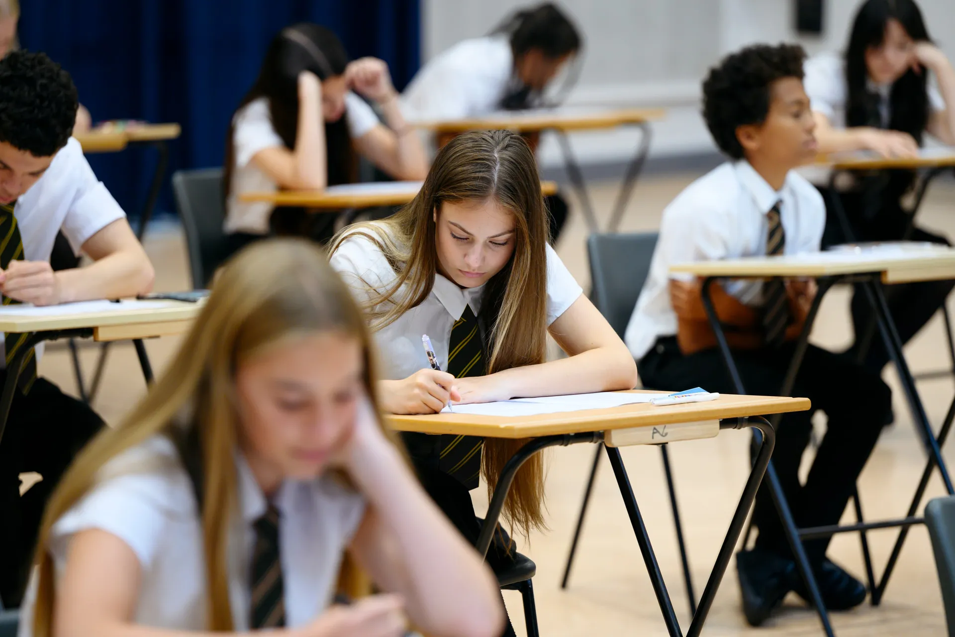 A Vaughan College student concentrating during an exam at her desk