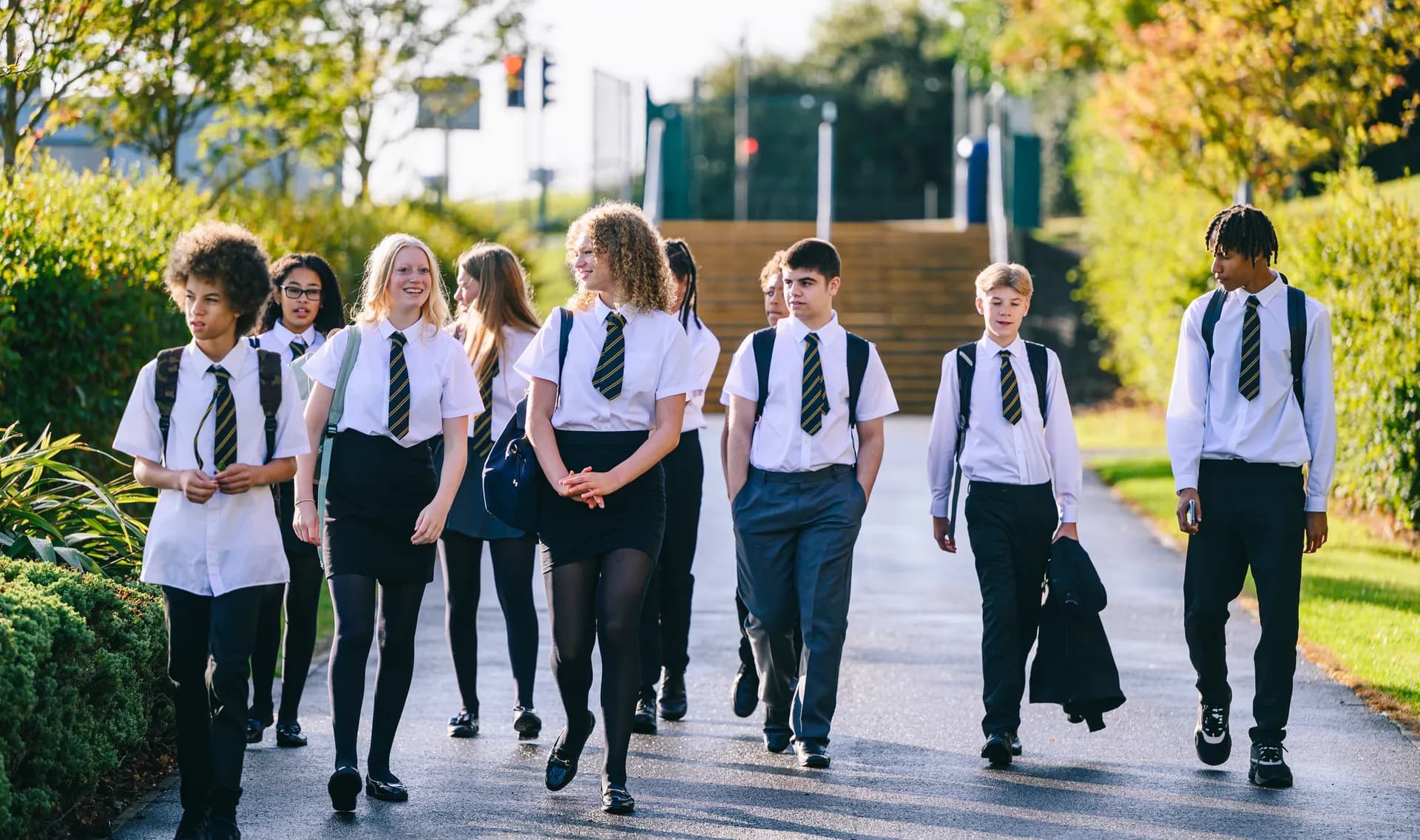 A diverse group of Vaughan College students arriving at school together with backpacks