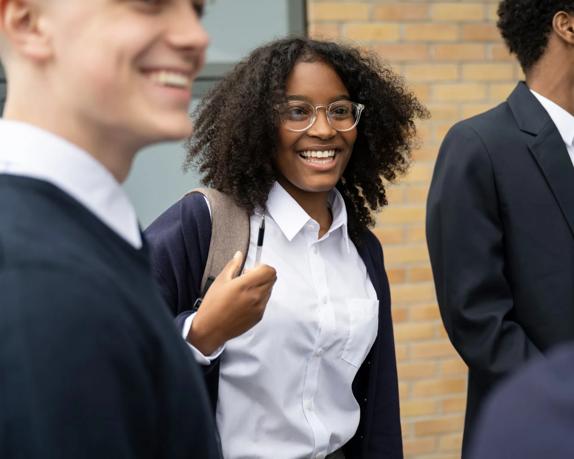 Vaughan College students laughing together between classes