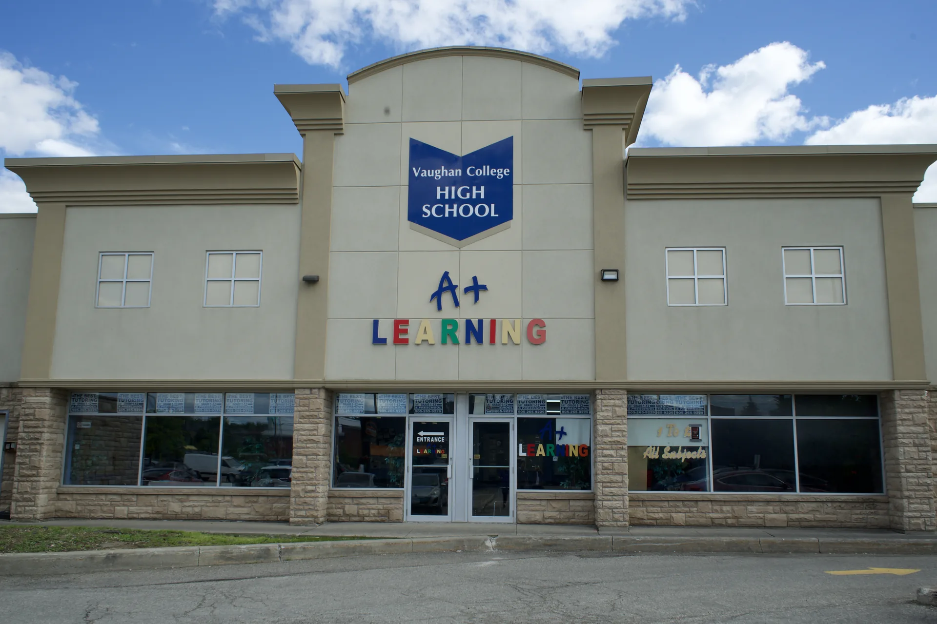 The exterior of Vaughan College's Woodbridge campus, with the school's signage above the main entrance